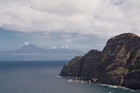 escarpment of gomeras east coast with view to tenerife, gomera island, spain. Gomera is one of the most attractive canary islands, depending to spain. It is a vulcan island. you can reach gomera by taking the ferry from teneriffa. No international flightsの写真素材