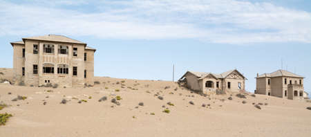 NAMIBIA, KOLMANSKOP - SEPTEMBER, 14. 2014: Ghost Town Kolmanskop, former Diamond Dagger Town in desert stripe near Luederitz. It was used from 1908 till 1930. Now it's abandoned and desertificated.のeditorial素材