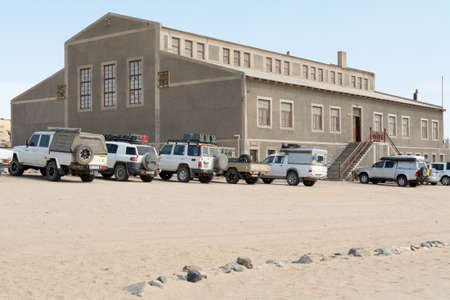 NAMIBIA, KOLMANSKOP - SEPTEMBER, 14. 2014: Ghost Town Kolmanskop, former Diamond Dagger Town in desert stripe near Luederitz. It was used from 1908 till 1930. Now it's abandoned and desertificated. Main Building.のeditorial素材