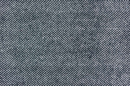 Detailed Close-Up of a gray herringbone fabric pattern for background purposes