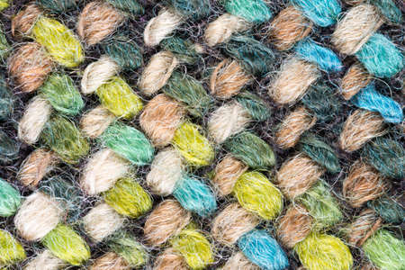 Detailed Close-Up of a multi colored fabric pattern for background purposesの写真素材