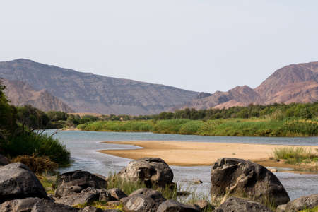 view on the oranje river in namibia, africa. the oranje river is the longest river in south africa and builds the border of namibia and south africa.の写真素材