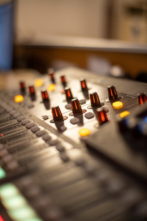 Audio mixing console in the recording studio. Shallow depth of field.の写真素材