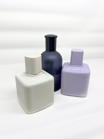 Perfume bottles on a white background, closeup of photoの写真素材