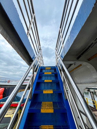 Blue and yellow metal stairs on a cruise ship.