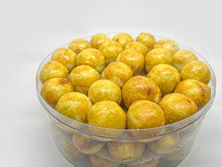 Crispy fried fruit in plastic container on white backgroundの写真素材