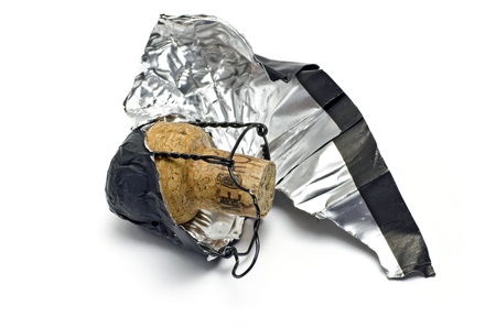 Champagne cork and foil cap; isolated on white groundの写真素材