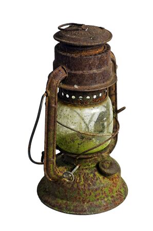 Hurricane lamp/storm lantern; very corroded vintage kerosene lamp; isolated on white groundの写真素材