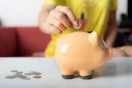 Piggy bank on white tableの写真素材