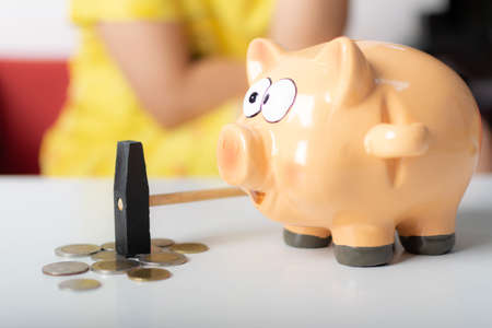 Piggy bank on white tableの写真素材