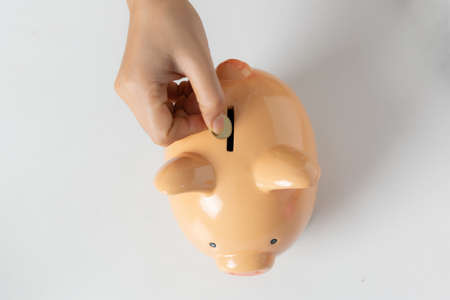 Piggy bank on white tableの写真素材
