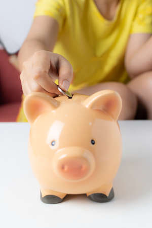 Piggy bank on white tableの写真素材