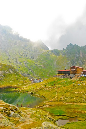 House by the lake in the mountains, Carpathians, Romania, Europeのeditorial素材