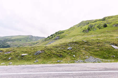 Photo of green capra peak, a road in fagaras mountains, Romania.の写真素材