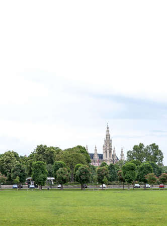 Photo view from park on town hall rathaus at daytime, vienna, austriaの写真素材