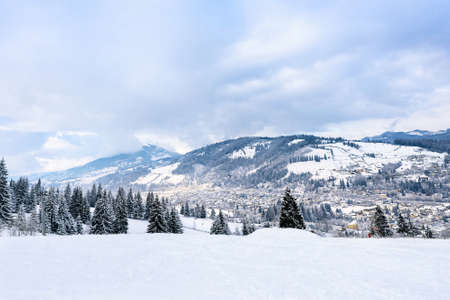 Beautiful mountains view with fog at resort town vatra dornei, bucovina, suceava, romaniaの写真素材