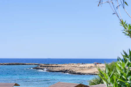 Sea view with immaculate water, beach and rocks, protaras, cyprus islandの写真素材