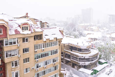 Heavy snow apocalypse in Moldova, frozen Chisinau city, on 20 and 21 of april 2017, spring anomaly, natural cataclysm, falling green trees disaster, general emergency state, exceptional situationの写真素材