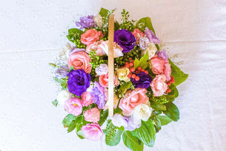 Summer flowers bouquet in a basket, white red and purple.の写真素材