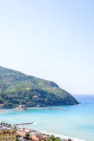 Beautiful daylight view to green mountains, blue sea and buildings of Levanto, Italy. Cinque Terre...