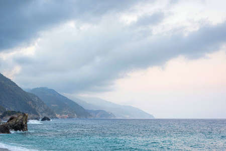 Beautiful view to Monterosso al Mare mountains and blue sea in cloudy day. Italy, Cinque Terreの写真素材