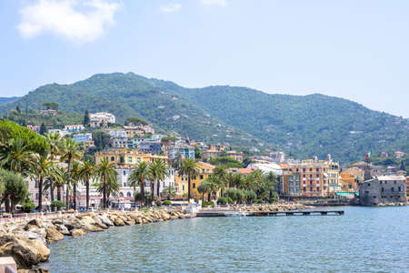 Daylight view to mountains, blue sea and city of Rapallo, Italy.の写真素材