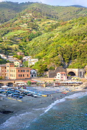 Beautiful daylight view to blue sea, green mountains and beachline. Monterosso al Mare, Italy. Cinque Terreの写真素材