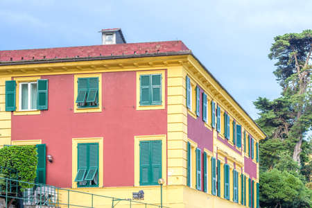 Daylight view on a red and yellow Hotel in Santa Margherita Ligure, Italy.の写真素材