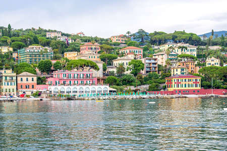 SANTA MARGHERITA LIGURE, ITALY - JUNE 27, 2017: Rainy and cloudy day in Santa Margherita Ligure. People walking on sidewalk near beach. Italy beautiesのeditorial素材