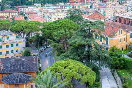 Beautiful sunset view from top to a road in Santa Margherita Ligure city, Italy. Scooter riding.の写真素材