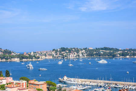 Beautiful daylight view to boats and ships on water in Villefranche-sur-Mer, France.