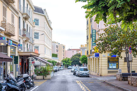 BEAULIEU SUR MER, FRANCE - JUNE 27,2017: Beautiful sunset view to buildings of city. Cloudy day.のeditorial素材