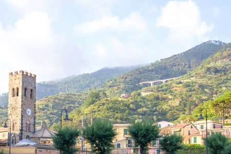 Daylight view to mountains, townbell and a part of city with people's houses in Monterosso al Mare. Cinque Terre beauties, Italyの写真素材