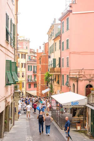 VERNAZZA, ITALY - JUNE 26, 2017: Daylight view to city streets. Tourists walking and local shops workingのeditorial素材