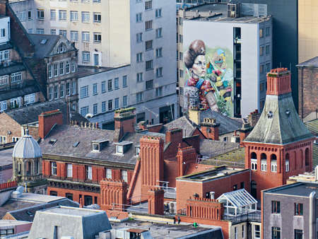 LIVERPOOL, UNITED KINGDOM - OCTOBER 29, 2017: Top view on old red brick building roofs with nomad graffitiのeditorial素材