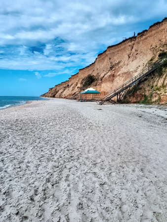 Black sea coast with high cliff and stairs in Kurortnoye, Ukraine