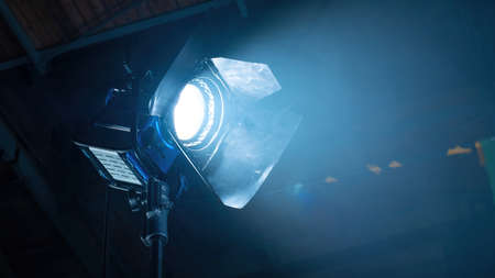 Professional lighting equipment on the movie set with smoke in the airの写真素材