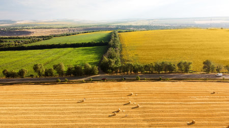 Aerial drone view of nature in Moldova. Field with haystacks and roadsの写真素材