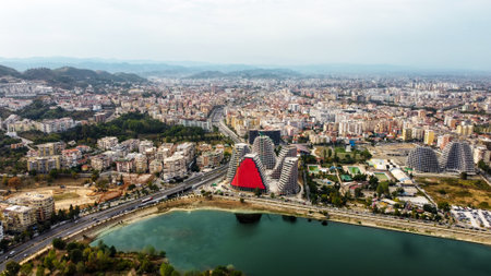 Aerial drone view of Tirana, Albania. City centre with modern buildings, residential district and greenery, lakeの写真素材