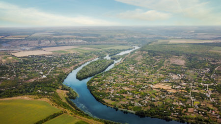 Aerial drone view of nature in Moldova. Dniester river with an island, villages and a lot of greenery aroundの写真素材