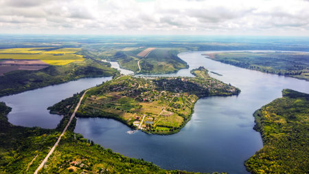 Aerial drone view of nature in Moldova. Dniester river with an island, green trees aroundの写真素材