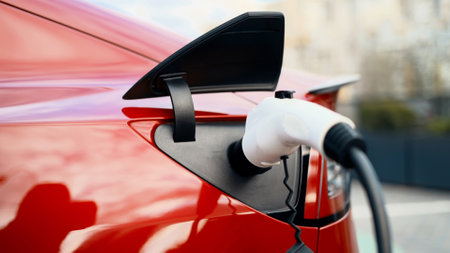 Close view of charging electric red carの写真素材