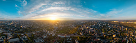 Aerial drone panoramic view of Chisinau at sunset, Moldova. Multiple visible residential districts, residential, governmental and office buildings, greeneryの写真素材