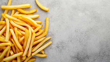 French fries on a gray concrete surfaceの素材