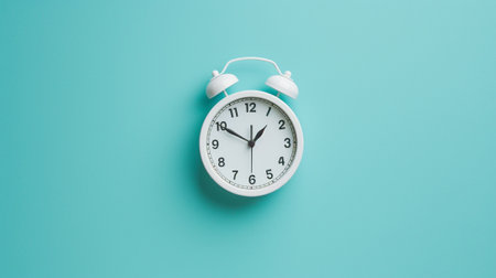 A white clock on a blue wallの素材
