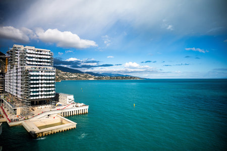 New buildings construction in the sea of Monaco, over blue sea and skyの写真素材