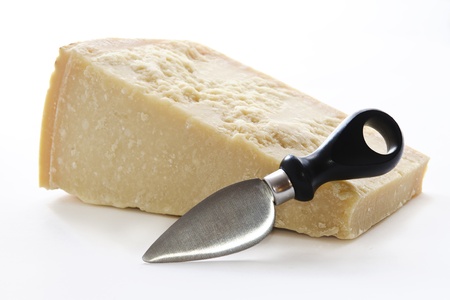 Parmisan cheese and knife in white backgroundの写真素材