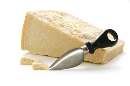Parmisan cheese and cheese knife in white backgroundの写真素材