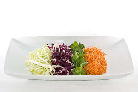 Salads food in white plate in white backgroundの写真素材