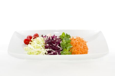 Salads food in white plate in white backgroundの写真素材